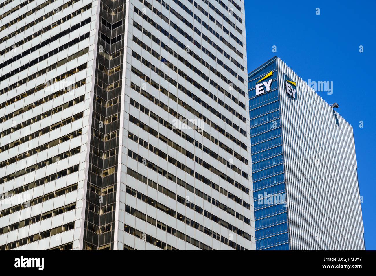 Closeup view of Bank of Montreal (BMO) building towering next to Ernst & Young (EY) office building, downtown Toronto, Ontario, Canada. Stock Photo