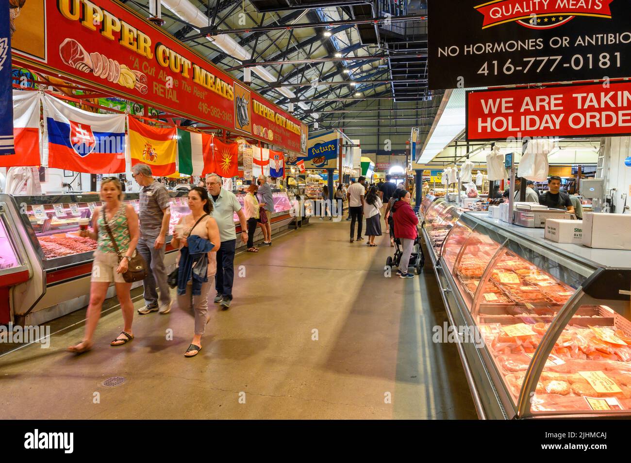 Inside St. Lawrence Market with meat stalls in downtown Toronto