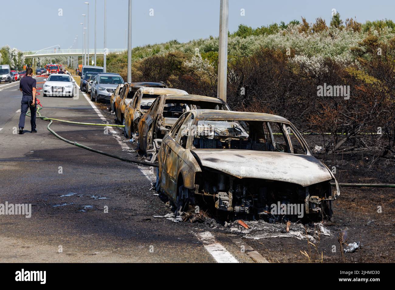 De Haan, Belgium, 19 July 2022. Burnt out cars pictured at on the scene of fires in the dunes at the Belgian coast in De Haan, caused by the heatwave on Tuesday 19 July 2022. The beaches have been evacuated. BELGA PHOTO KURT DESPLENTER Stock Photo