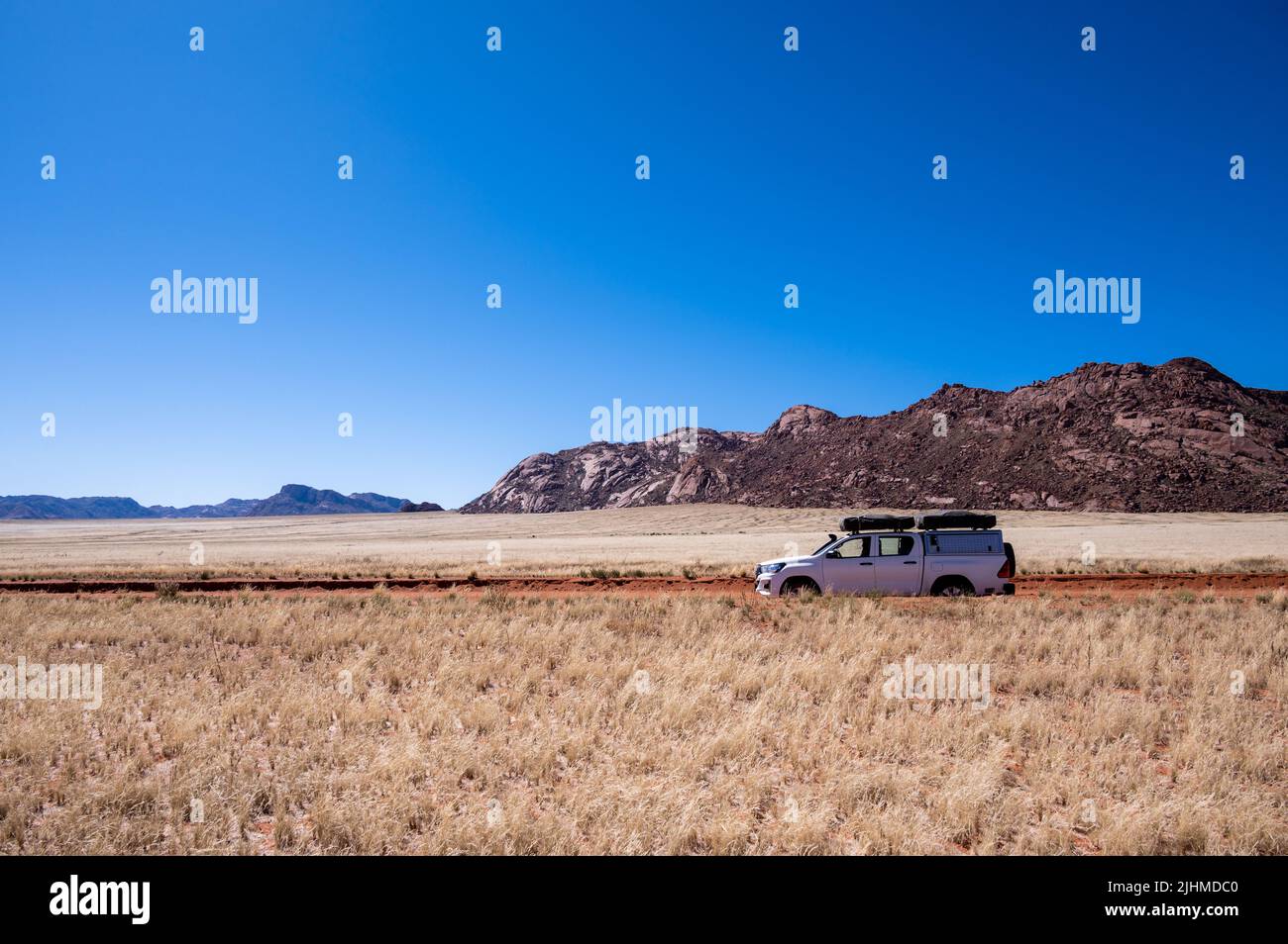 A 4x4 on a gravel road in Namibia Africa Stock Photo