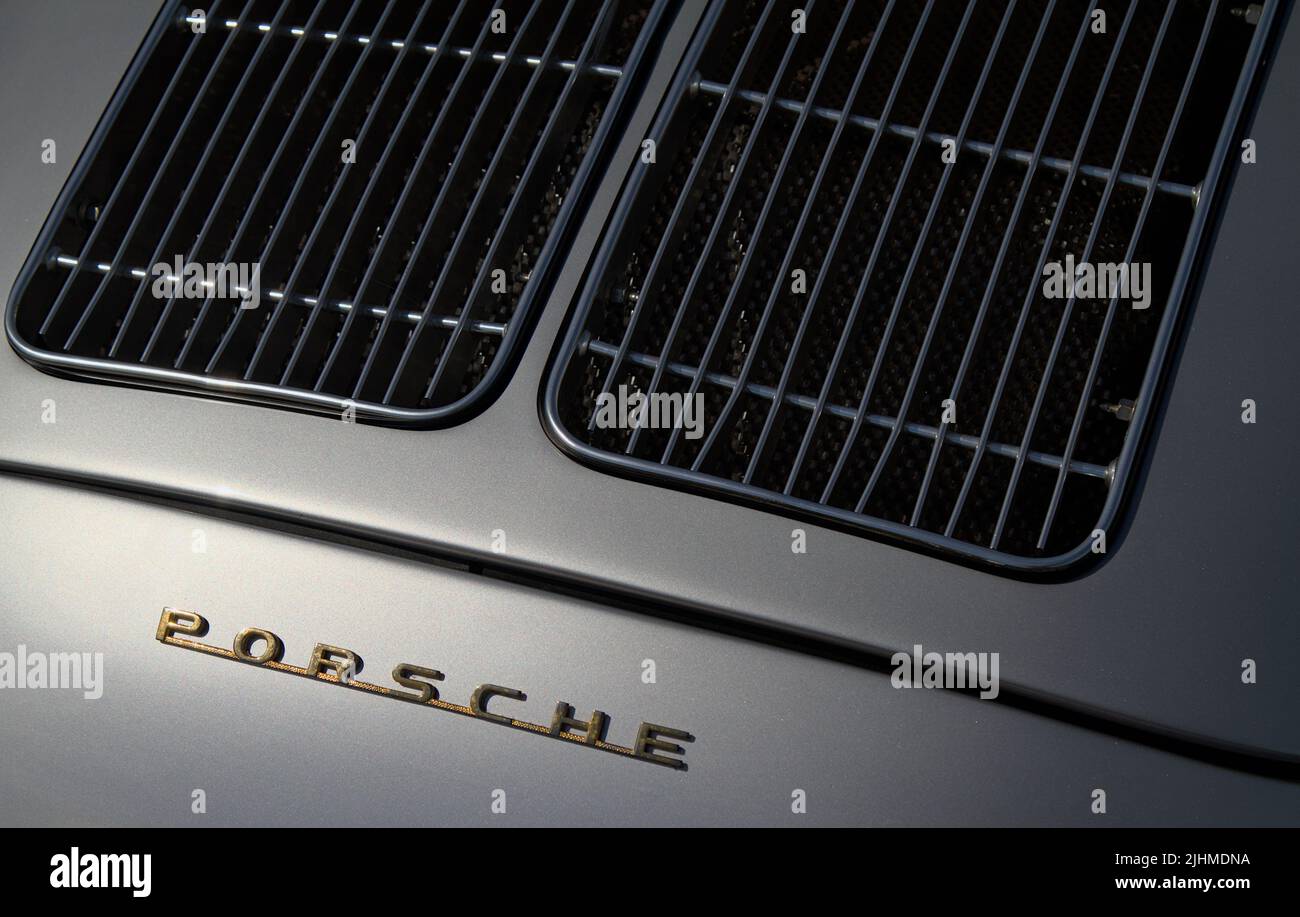 Rear Engine Grill And Porsche Badge Of A Silver Porsche 356A 1956 Speedster Classic, Vintage Motor Car, UK Stock Photo