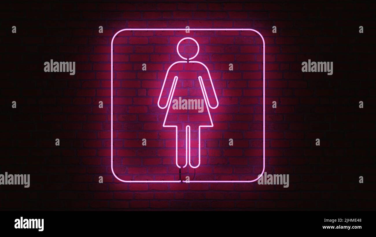 Neon Women Toilets Sign in pink color. Part of a series. Stock Photo