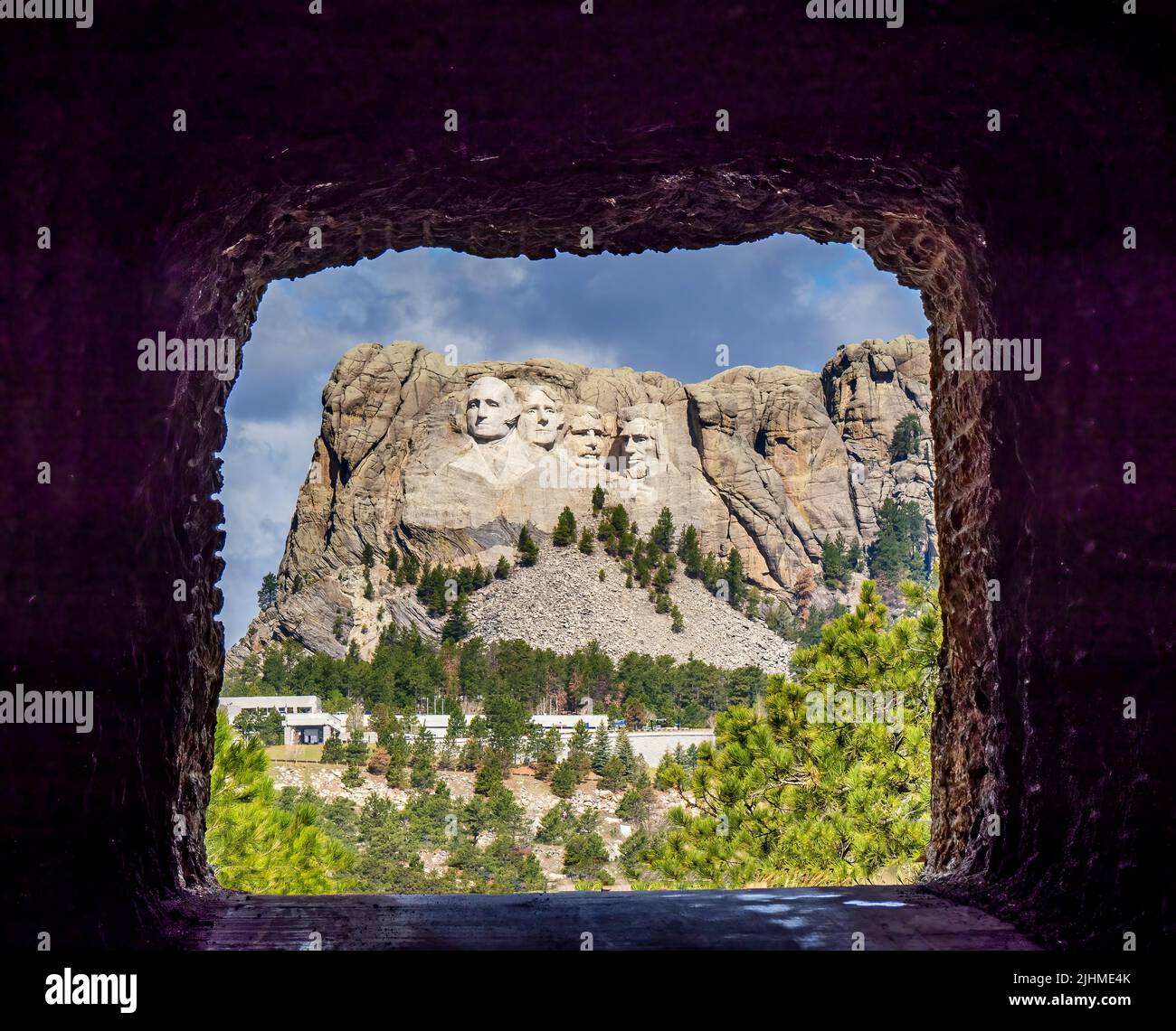 Mount Rushmore National Memorial though the Doane Robinson Tunnel on Iron MountaIn Road part of the Peter Norbeck Scenic National Byway in the Black H Stock Photo