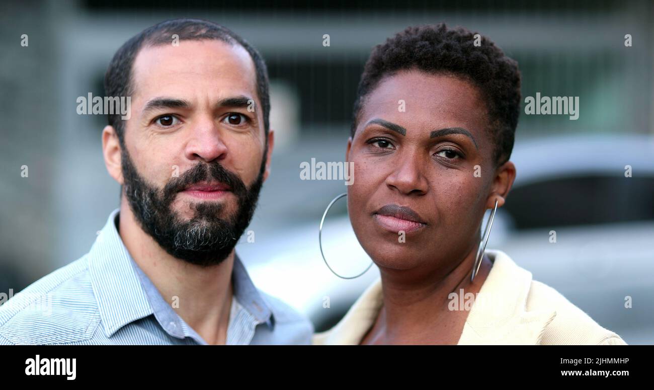 Interracial couple looking at camera. African wife, mixed race husband
