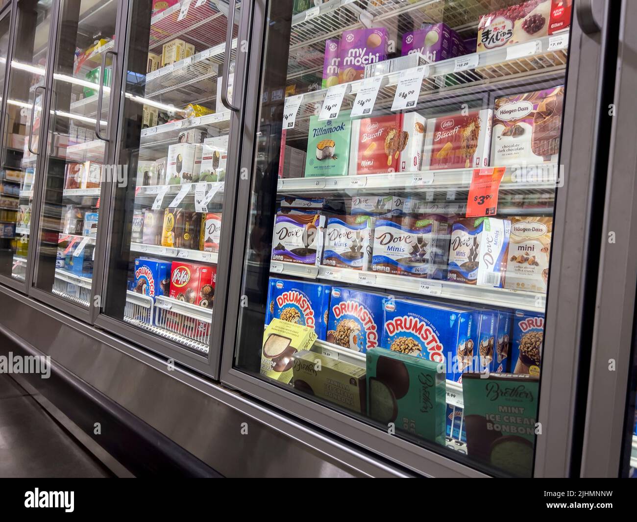 Mill Creek, WA USA - circa June 2022: Angled view of a variety of frozen treats inside the freezer section of a Town and Country grocery store. Stock Photo