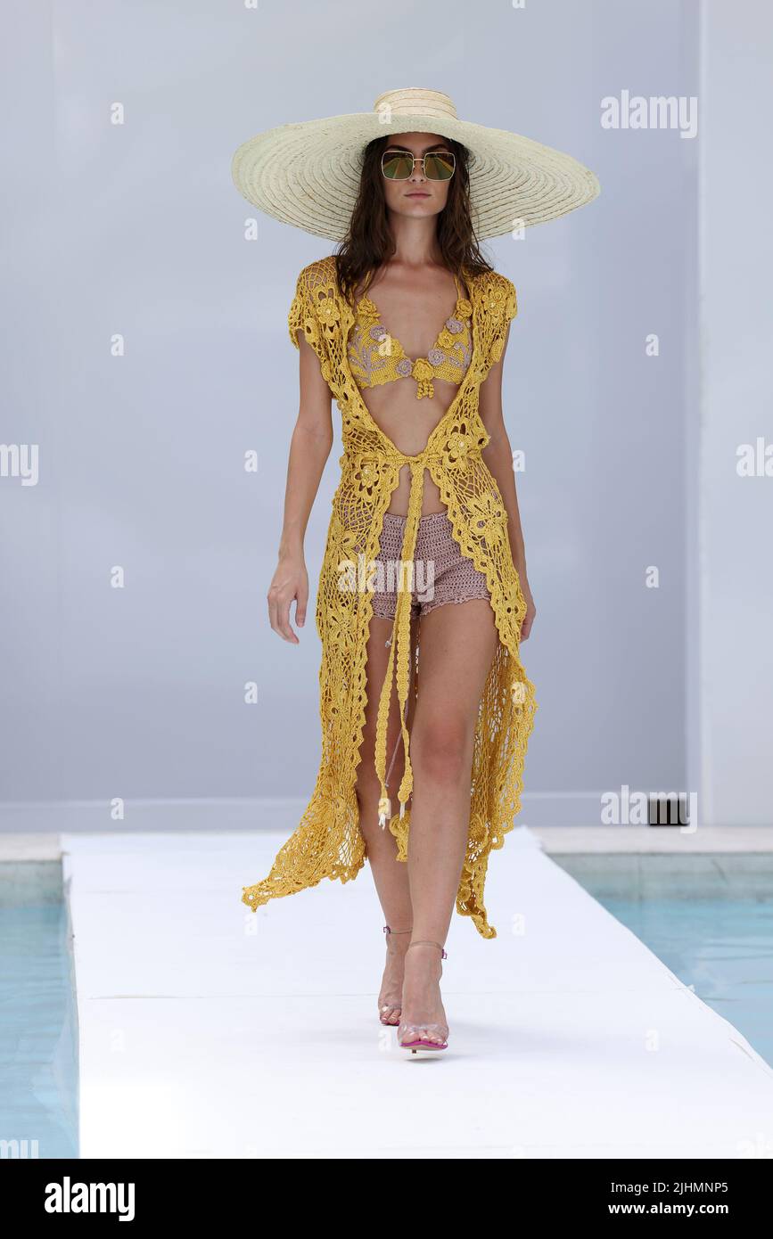 MIAMI BEACH, FLORIDA - JULY 18: A model walks the runway wearing Anicy  Manuguian with Tribal Eyes, Diosa by Michael Rodriguez jewelry and Iza by  Silvia D'Avila Jewelry during Flying Solo Miami