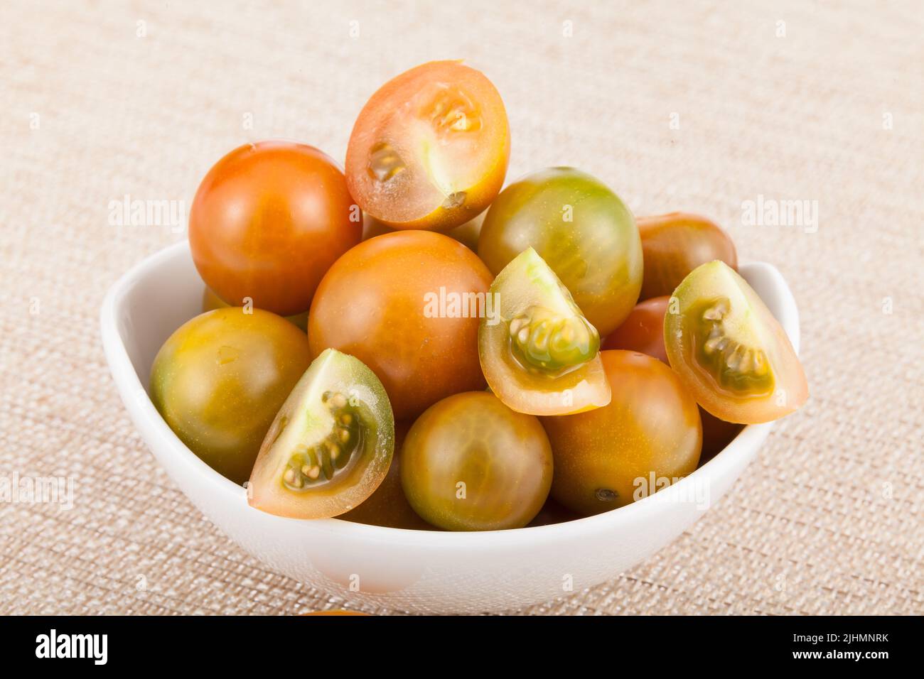 Bowl with cherry tomatoes - Solanum pimpinellifolium. Stock Photo