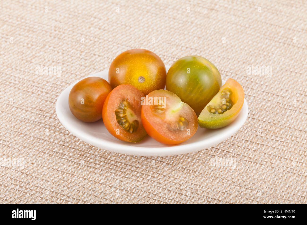 Bowl with cherry tomatoes - Solanum pimpinellifolium. Stock Photo