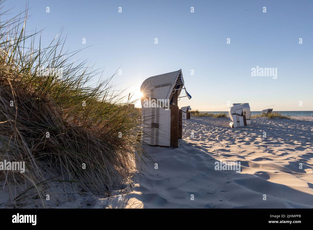 beach chair in prerow in the evening sun Stock Photo