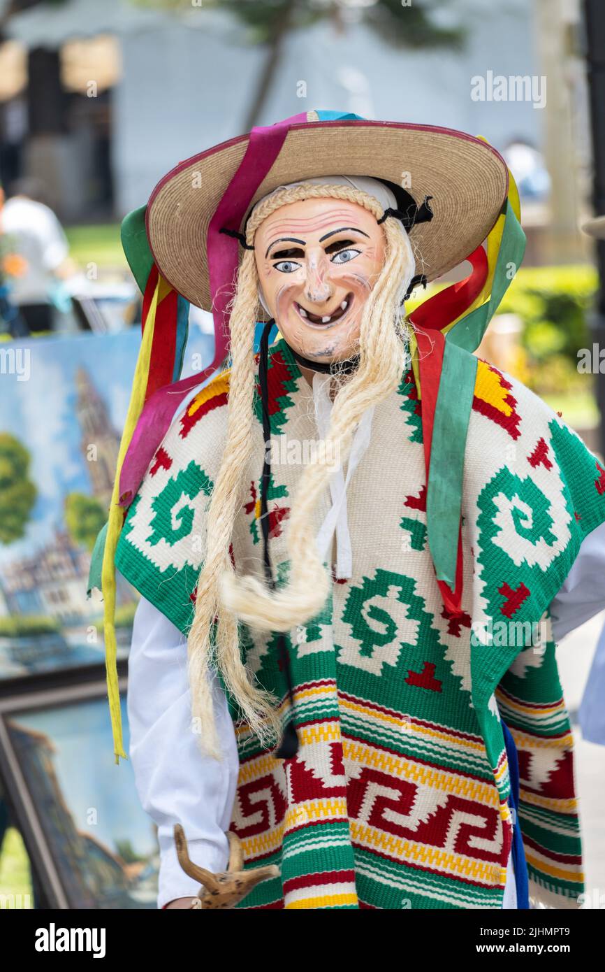 A young Mexican boy, dressed in an old man costume, performs the traditional Danza de los Viejitos at the Plaza Vasco de Quiroga town square, April 11, 2022 in Patzcuaro, Michoacan, Mexico. Stock Photo