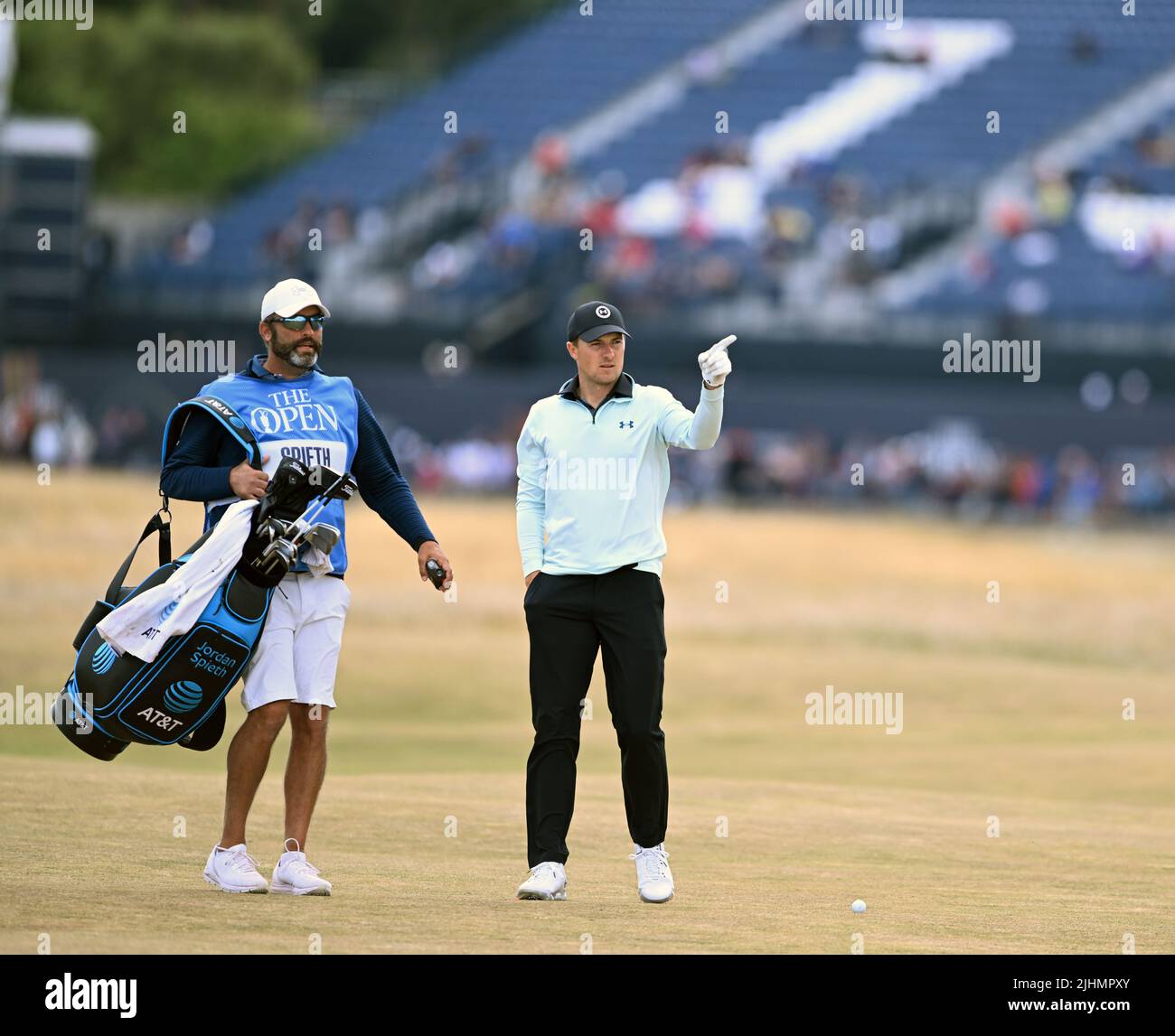 150th Open GolfChampionships, St Andrews, July 13th 2022 Jordan Spieth points the way to caddy Michael Greller on the 2nd fairway during his practice Stock Photo