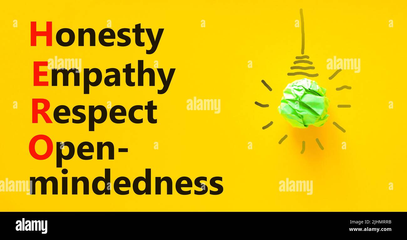 HERO honesty empathy respect open-mindedness symbol. Concept words HERO honesty empathy respect open-mindedness on yellow background. HERO honesty emp Stock Photo