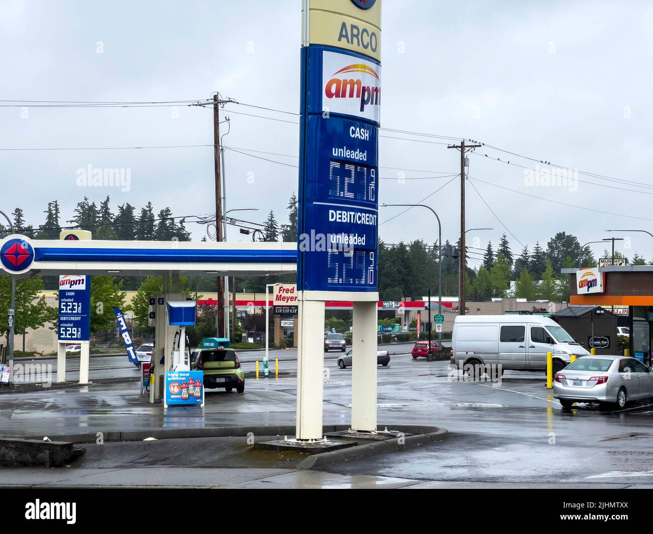 Everett, WA USA - circa July 2022: Wide angle view of a gas station during a price inflation in summer. Stock Photo