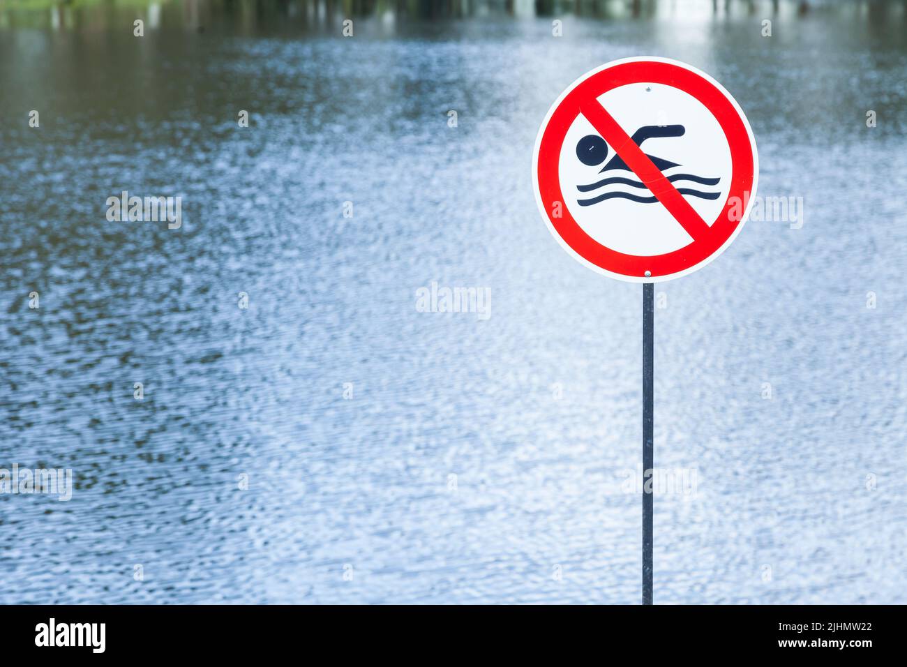 Lake with prohibited sign swimming. Stock Photo