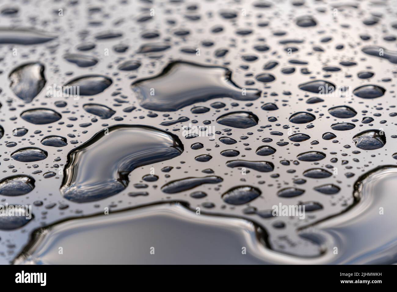 water drops on a black glass surface Stock Photo