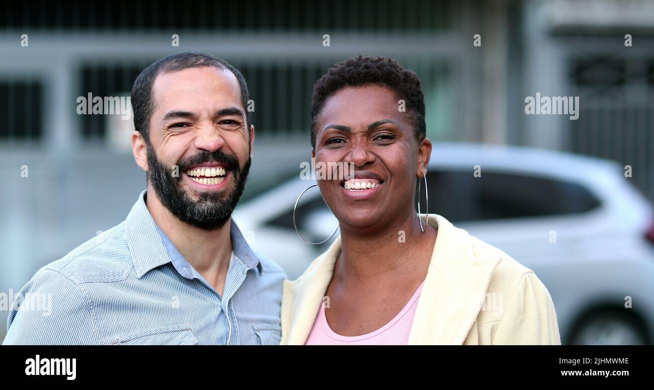 Married interracial couple laughing and smiling. African wife and