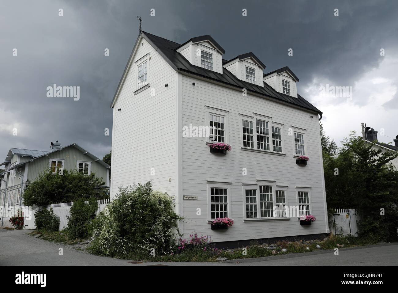 Stormy sky over houses on the Swedish island of Vaxholm in Stockholm Stock Photo