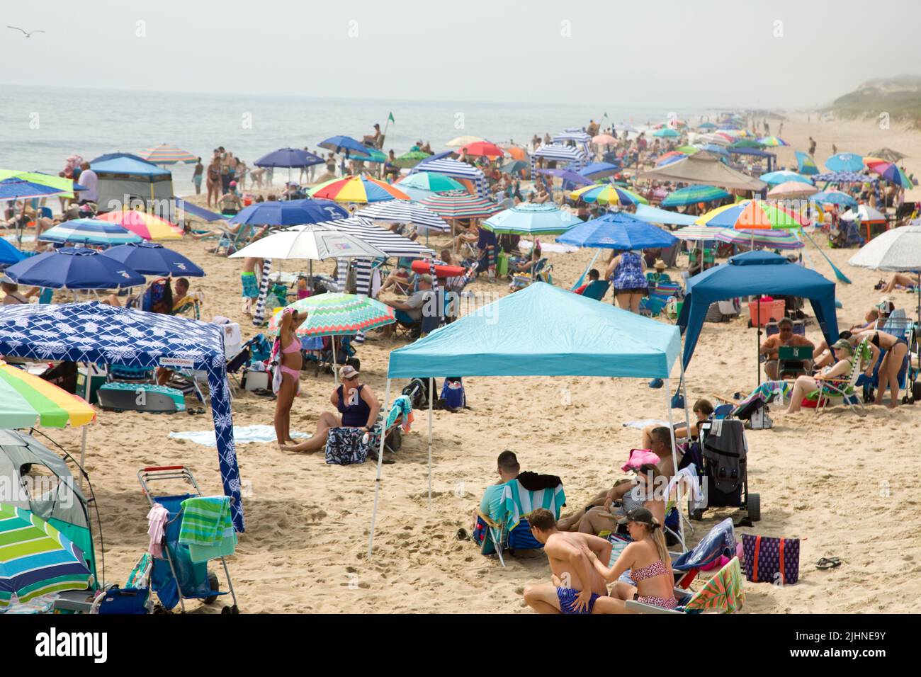 Sunbathers at a crowed Delaware USA beach Stock Photo