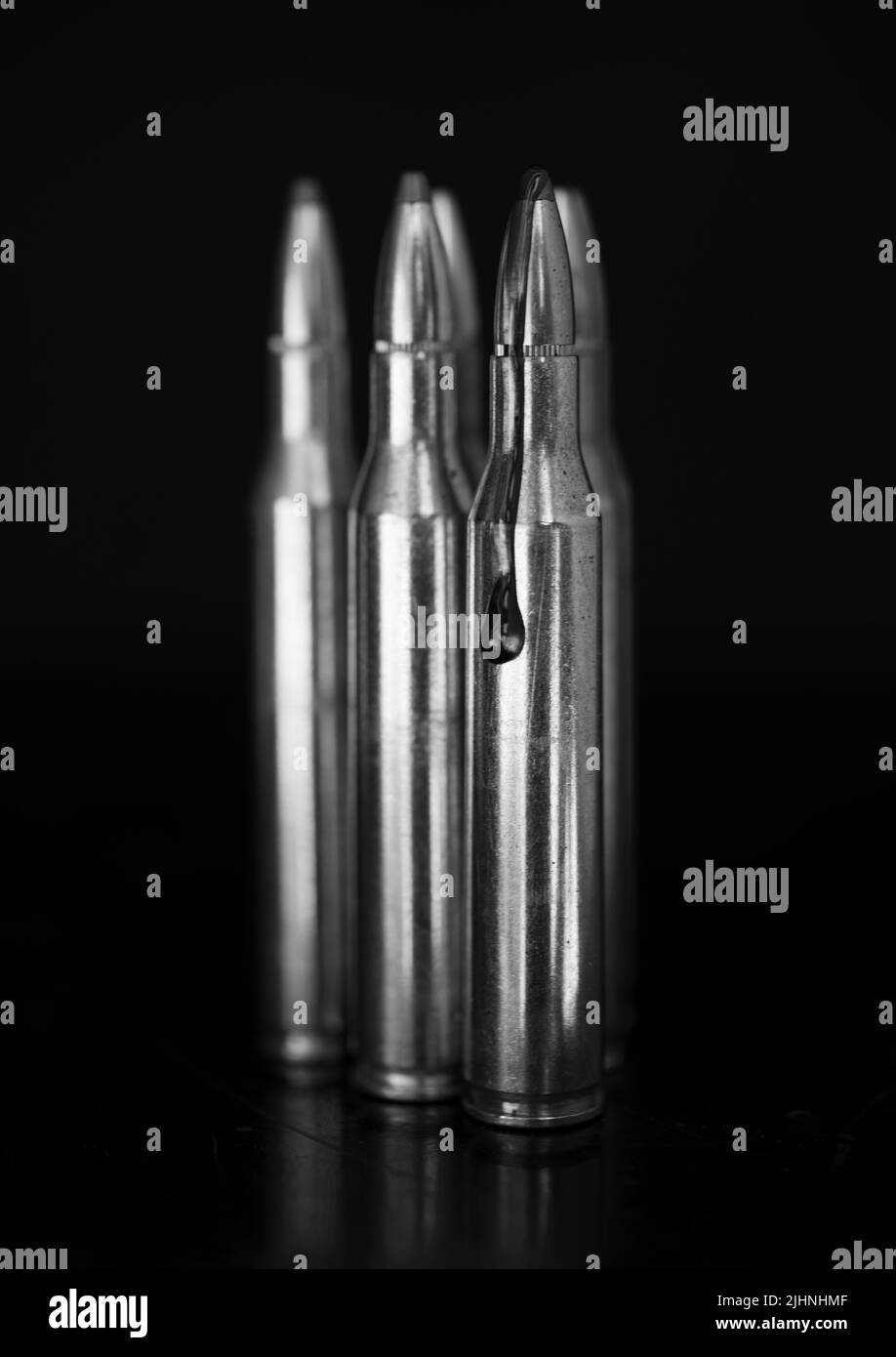 AR-15 style rifle cartridge and blood (photoillustration). Stock Photo