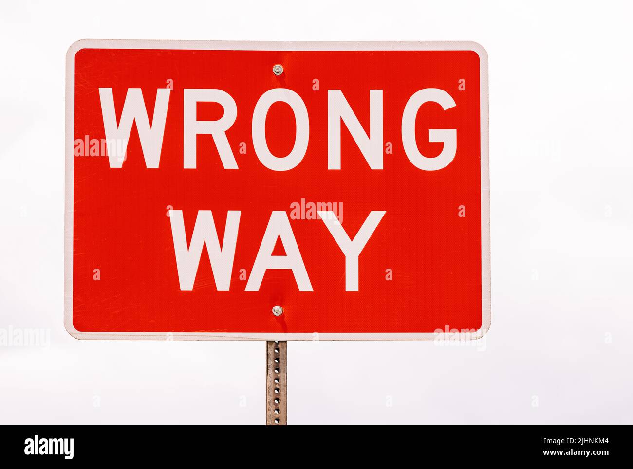 Wrong way sign on the road Stock Photo