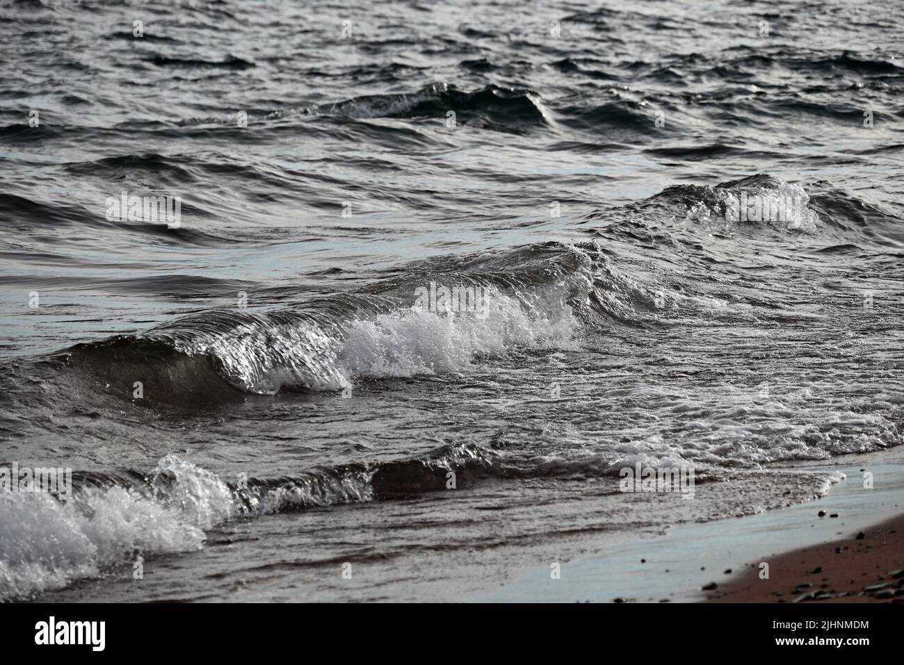 Waves break on the shoreline of Lake Superior in the Apostle Islands National Lakeshore. Stock Photo