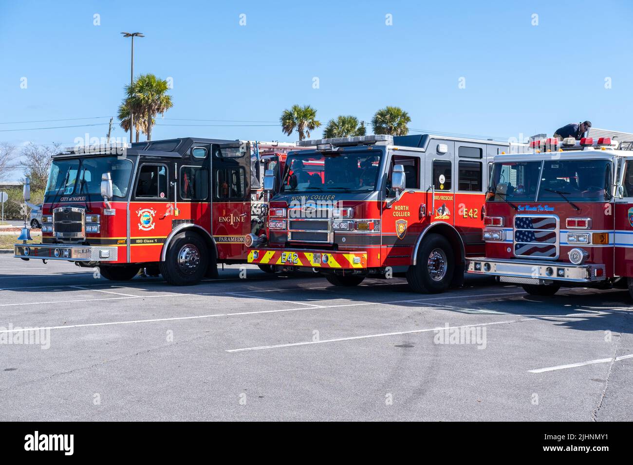 Fire trucks lined up at a command center in Pensacola, FL, ready for