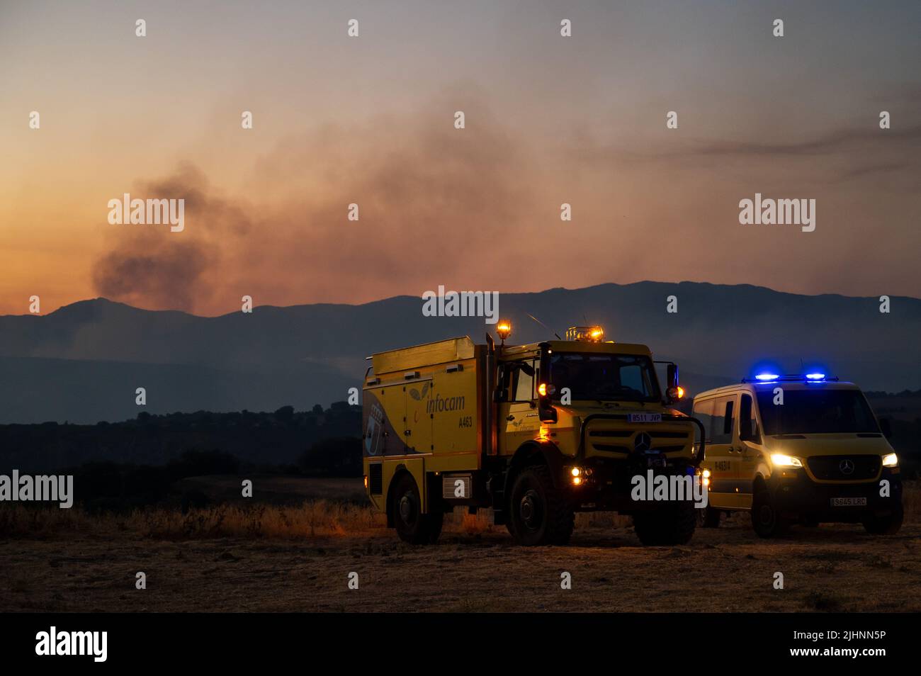 Guadalajara, Spain. 19th July, 2022. Firefighter vehicles are seen near Valdepeñas de la Sierra, where a fire has forced to evacuate nearly 70 residents from the area. Wildfires have broken out across Spain amid a severe heatwave. Credit: Marcos del Mazo/Alamy Live News Stock Photo