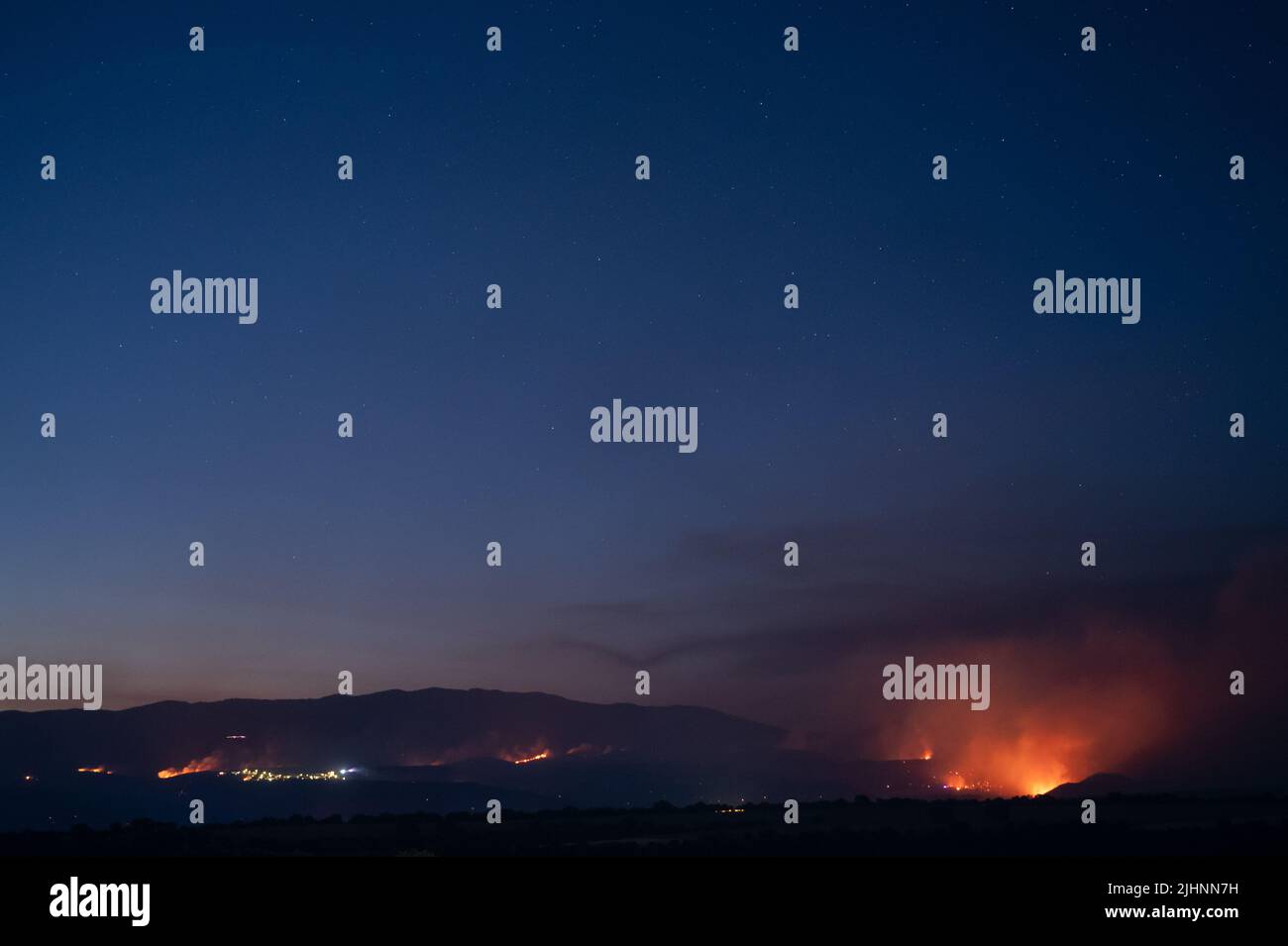 Guadalajara, Spain. 19th July, 2022. Wildfires are seen near Valdepeñas de la Sierra, where several fires have forced to evacuate nearly 70 residents from the area. Wildfires have broken out across Spain amid a severe heatwave. Credit: Marcos del Mazo/Alamy Live News Stock Photo