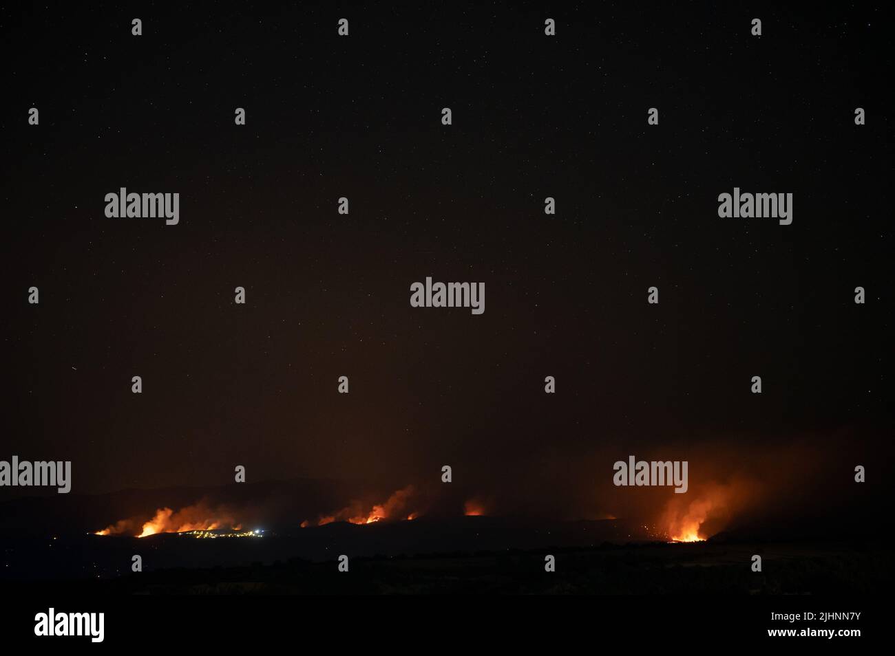 Guadalajara, Spain. 20th July, 2022. Wildfires are seen near Valdepeñas de la Sierra, where several fires have forced to evacuate nearly 70 residents from the area. Wildfires have broken out across Spain amid a severe heatwave. Credit: Marcos del Mazo/Alamy Live News Stock Photo