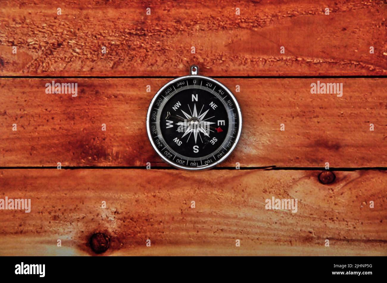Navigation compass on wooden table background Stock Photo