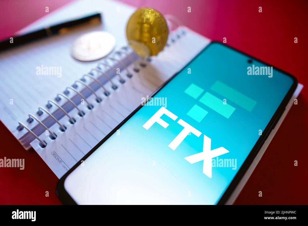 Brazil. 19th July, 2022. In this photo illustration, the FTX Crypto Derivatives Exchange logo seen displayed on a smartphone screen, on the side of Bitcoin cryptocurrencies. Credit: SOPA Images Limited/Alamy Live News Stock Photo