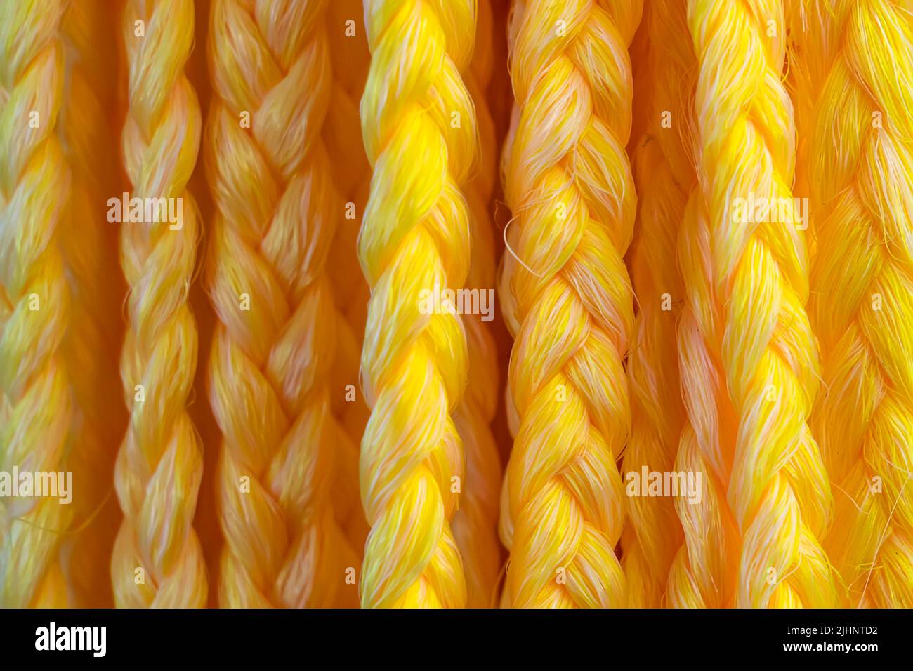 Braiding hair Extensions Synthetic Braids Hair Colors. yellow hairs for stylist. Beauty salon Stock Photo