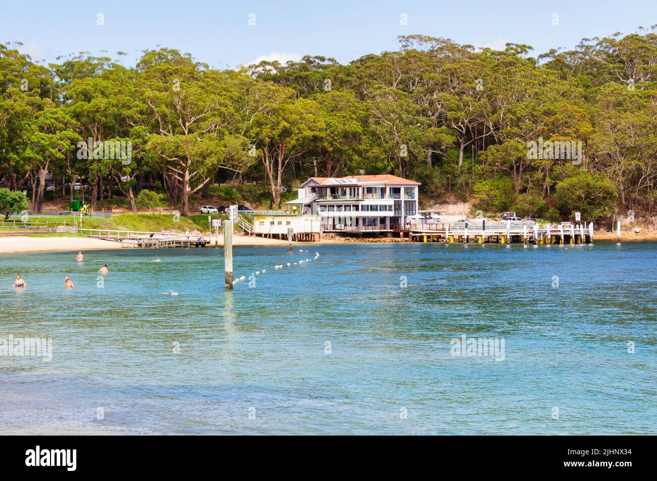 Beach, restaurant and bar on the Little Beach foreshore - Nelson Bay, NSW, Australia Stock Photo