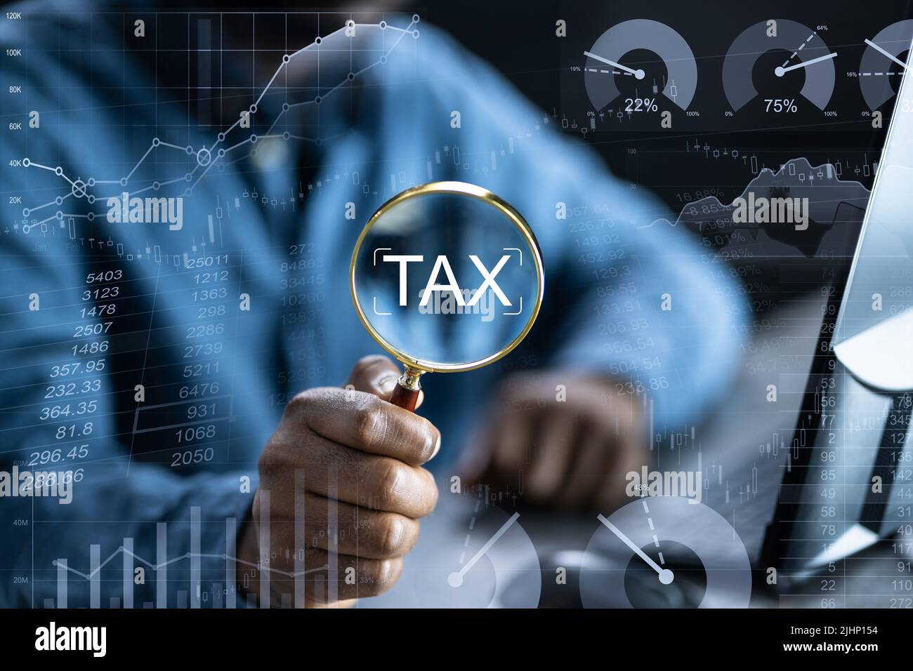Tax Credit Deduction On Magnifying Glass. African American Hand Stock Photo
