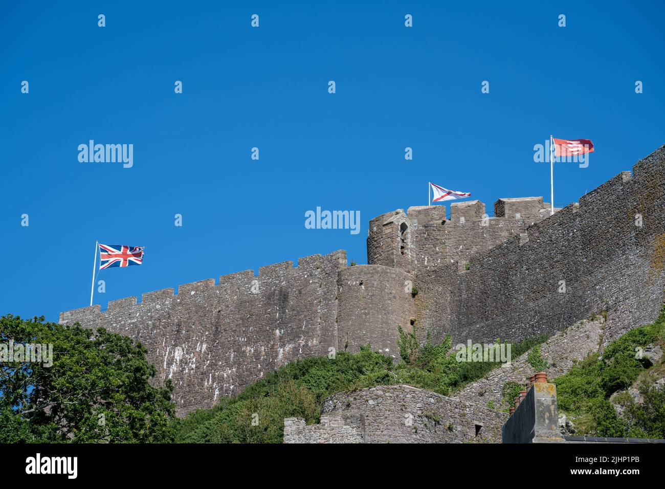 The iconic Mont Orgueil Castle guarding the entrance to Gorey harbour of the British Crown Dependency of Jersey, Channel Islands, British Isles. Stock Photo