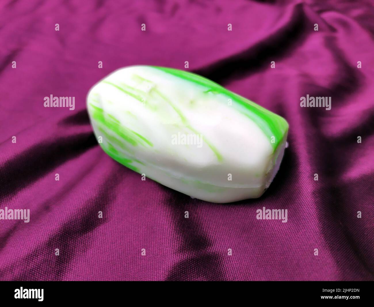 white and green soap on silk cloth Stock Photo