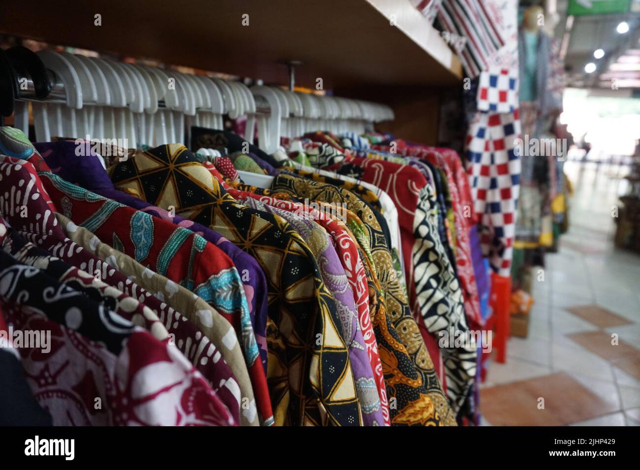 Solo, Indonesia - July 16th, 2022.Hanging Batik shirt at the Pusat Grosir Solo Market. One of many Batik market in the city. Stock Photo