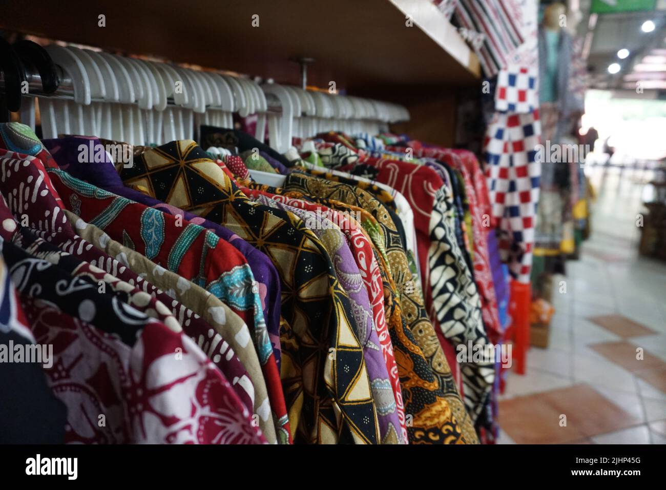 Solo, Indonesia - July 16th, 2022.Hanging Batik shirt at the Pusat Grosir Solo Market. One of many Batik market in the city. Stock Photo
