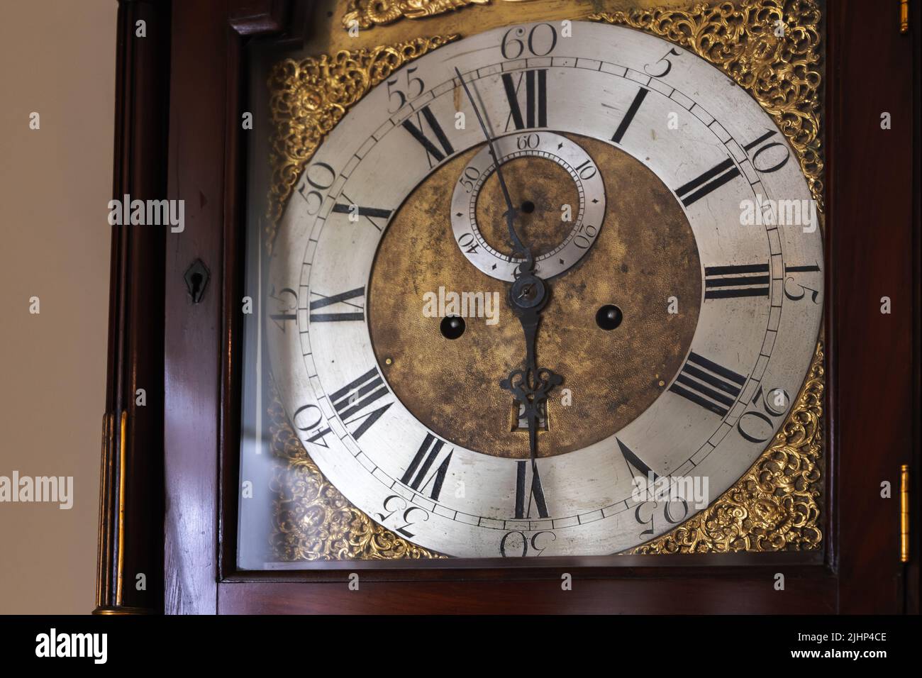 Vintage grandfather clock deal with Roman numerals. Close-up photo Stock Photo