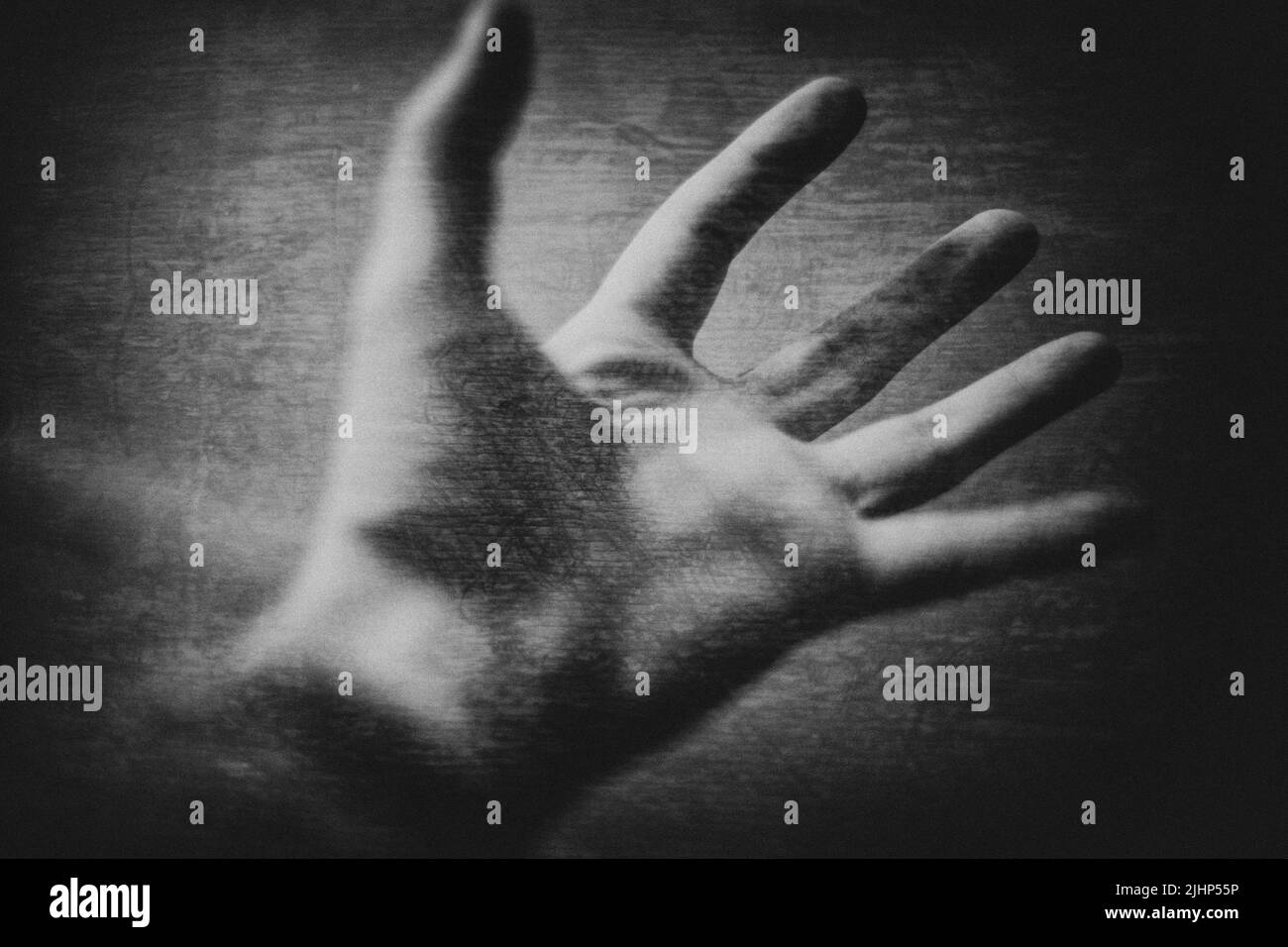 Black and white photograph of an outstretched hand Stock Photo