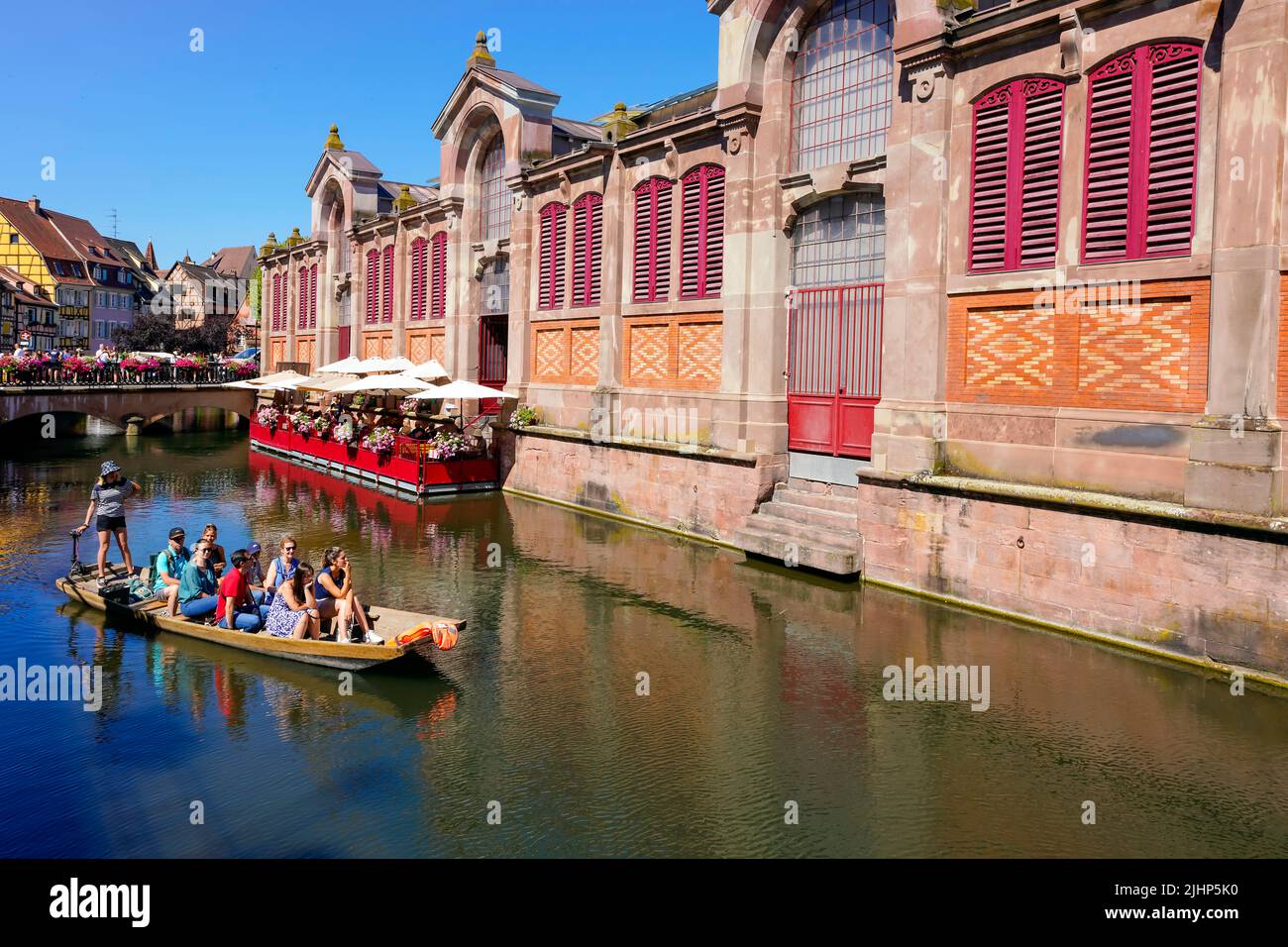 So-called Little Venice (Petite; Venise) by Lauch river in Colmar. Colorful traditional Alsatian market hall in the historic town of Colmar, Alsace, F Stock Photo
