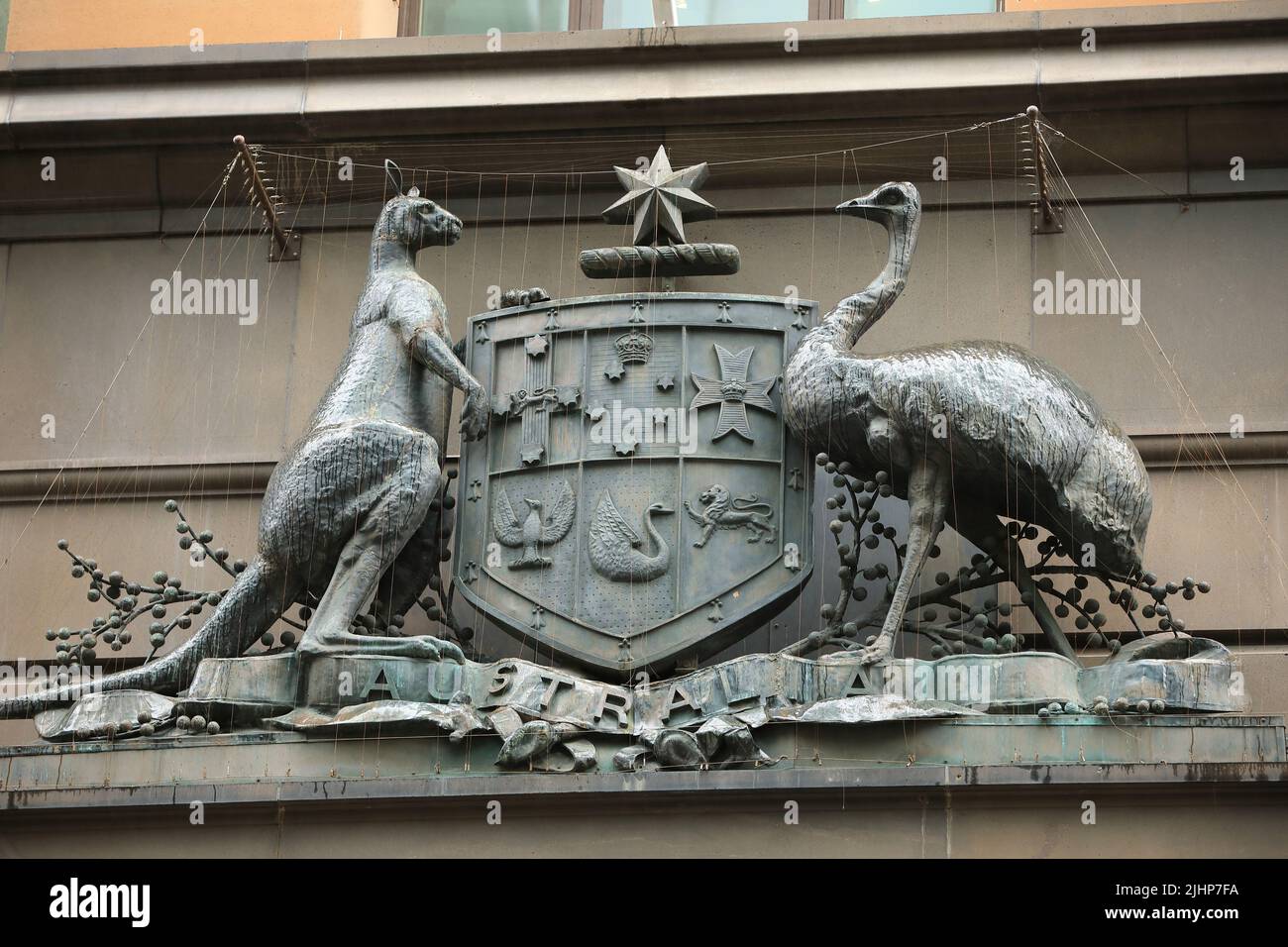 Sydney, Australia - 19 July 2022. A sculpture of the Australian coat of arms in the rain. The sculpture sits on the front of the old Commonwealth Bank. Stock Photo