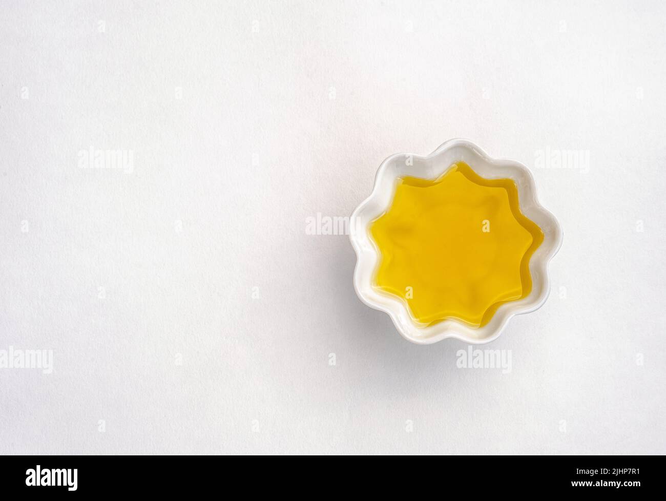 Olive oil. Spain olive oil in ceramic pot. Closeup, Isolated on white