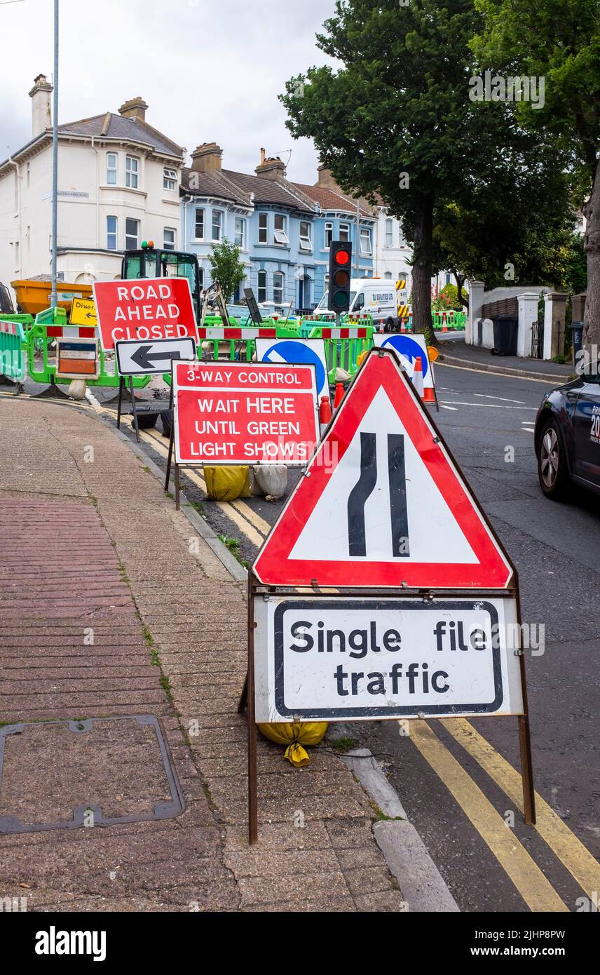 Single Line Traffic sign at roadworks by Queens Park in Brighton as gas mains are replaced Stock Photo