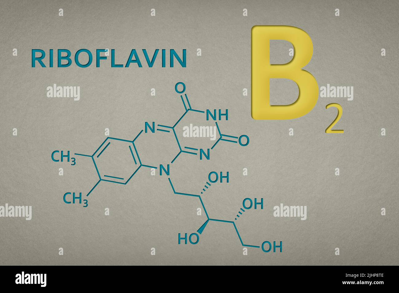 Vitamin B2. Riboflavin molecule on paper texture background. Skeletal