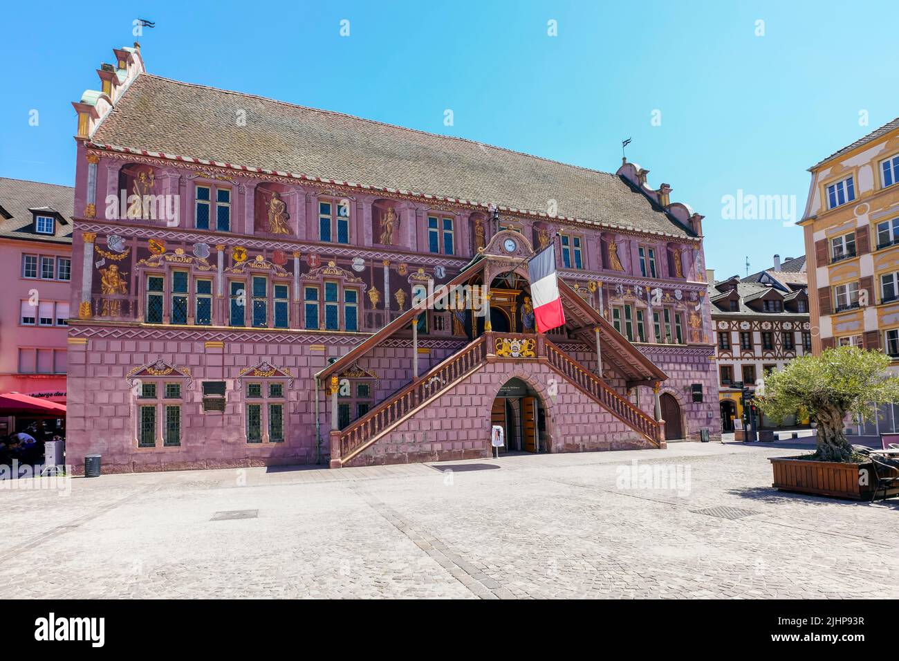 Former Town Hall in Mulhouse, Alsace, France. Its façade was decorated in 1698 by Jean Gabriel  in visual illusion representing allegoric figures. Stock Photo