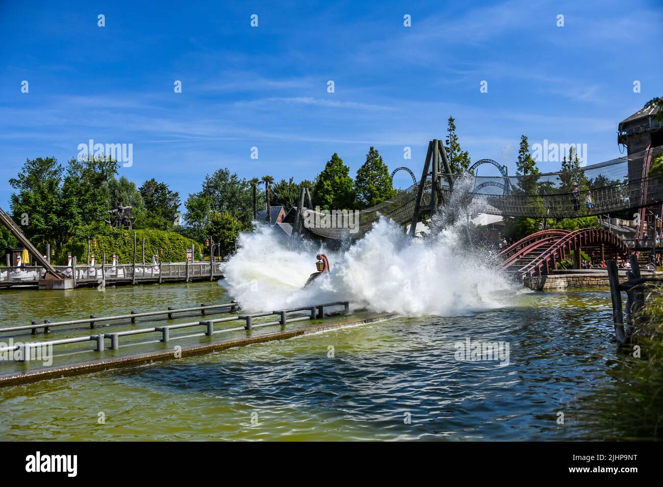 People ride SuperSplash, a water ride at Plopsaland in De Panne, in ...