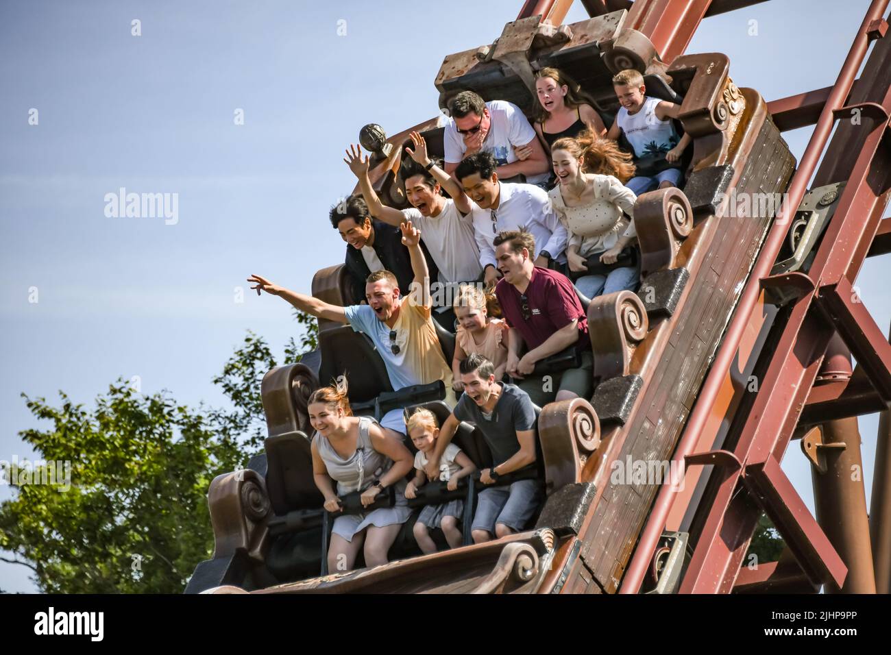 People ride SuperSplash, a water ride at Plopsaland in De Panne, in Belgium. Stock Photo