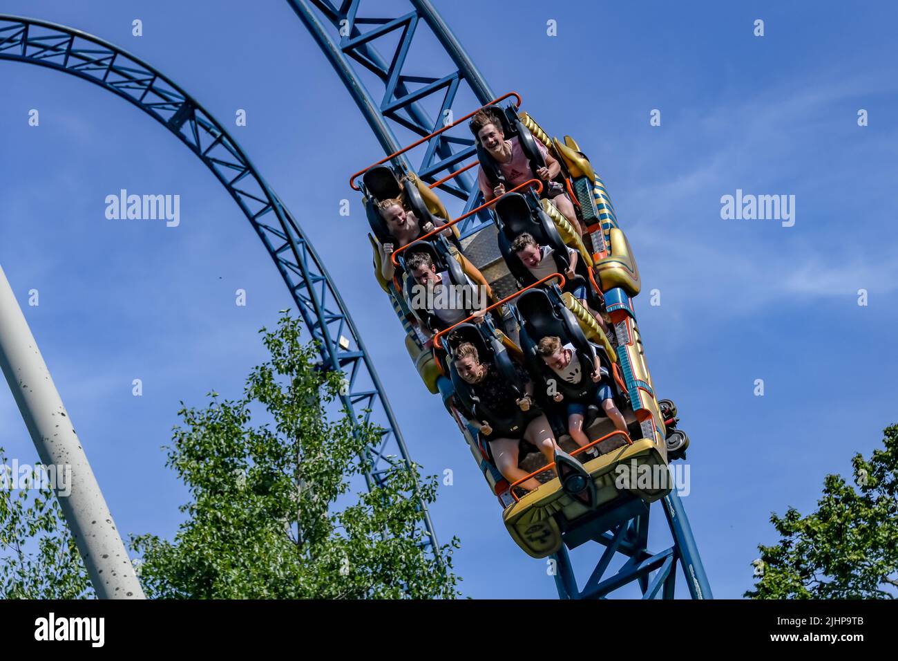 People ride 'Anubis The Ride', a steel roller coaster located at Plopsaland in Belgium Stock Photo