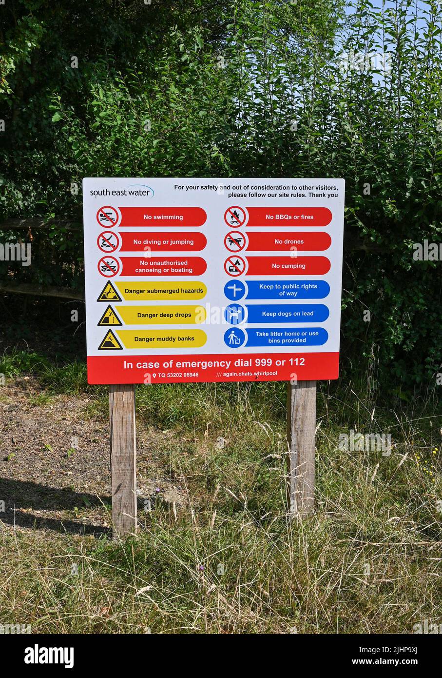 Arlington Reservoir near Lewes in East Sussex , England UK - South East Water sign warning people not to swim use drones light BBQs ( Barbecues) no camping no jumping into water and various safety measure Stock Photo